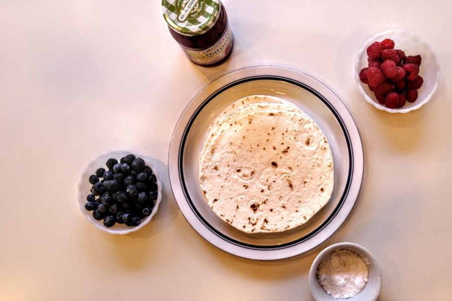 Memorial Day Weekend Recipes Tortillas, a Bowl of Blueberries, a Bowl of Strawberries, a Bowl of Bananas
