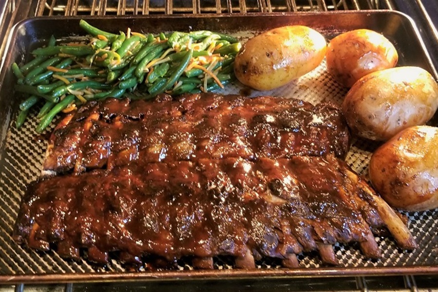 Memorial Day Weekend Recipes Easy Crockpot BBQ Ribs Recipe on a Baking Tray with Potatoes and Greenbeans