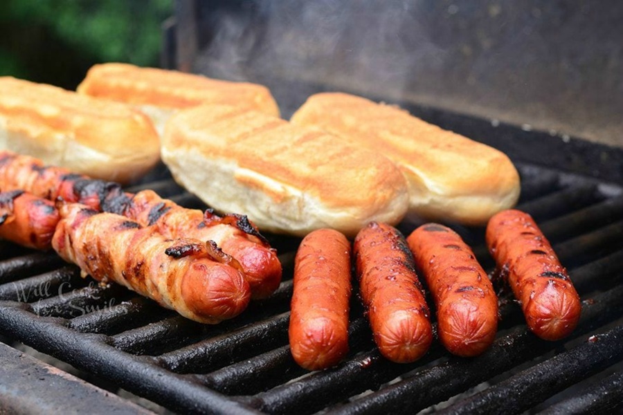 4th of July Party Ideas Bacon and Fried Onions BBQ Hot Dogs on a Grill