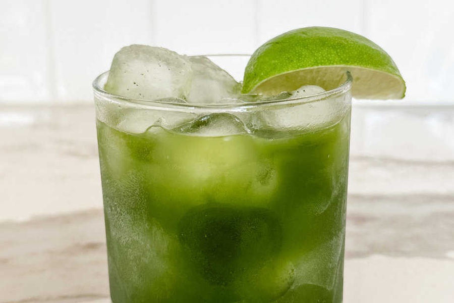 Summer Margarita Recipes Matcha Margarita with a Lime Wedge on the Rim
