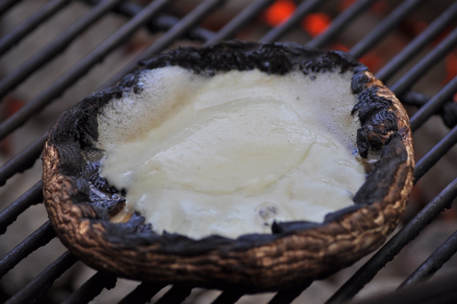 Portobello Mushroom Burger Mushroom Cap Filled with Mozzarella on a Grill