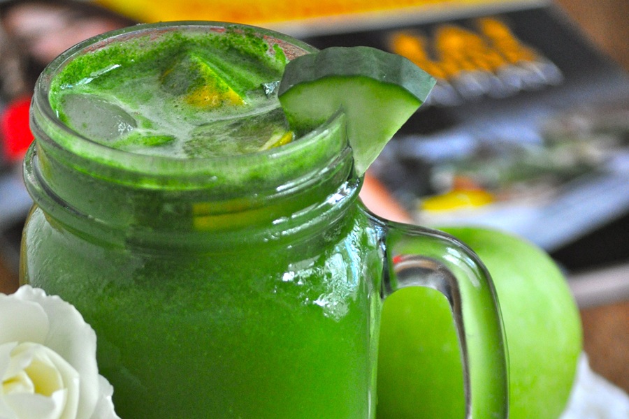 Jillian Michael&rsquo;s Green Juice Recipe in a Mason Jar Glass with a Cucumber Wedge Garnish