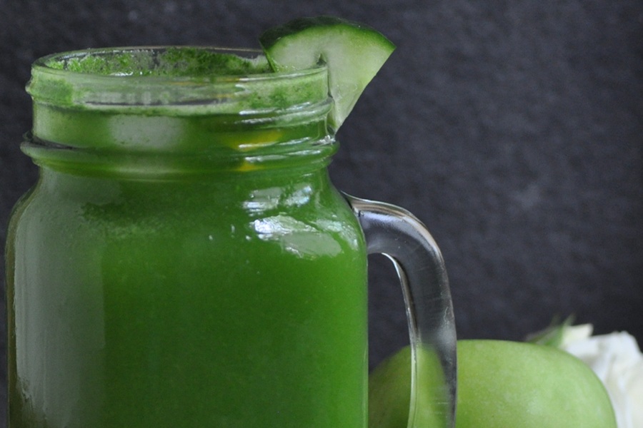 Jillian Michael&rsquo;s Green Juice Recipe in a Mason Jar Glass with a Cucumber Wedge Garnish