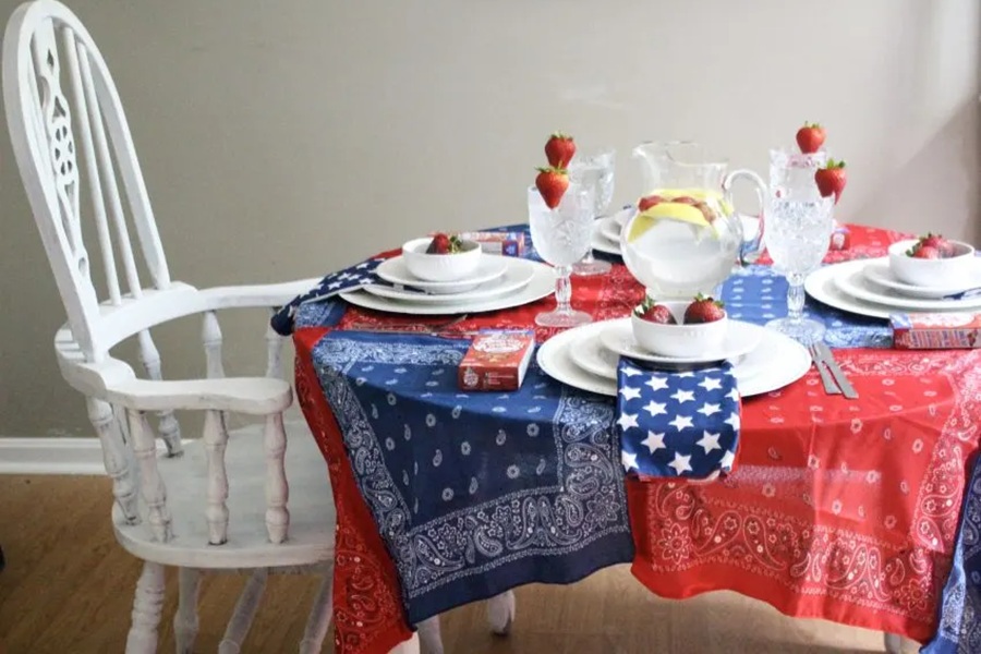 DIY Patriotic Decorations No-Sew Patriotic Tablecloth From Bandanas on a Table with Full Settings