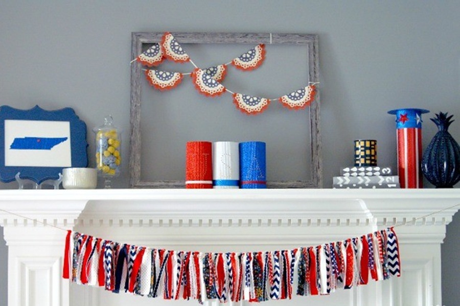 DIY Patriotic Decorations Rag Ribbon Garland Hanging From a Mantel with Candles on Top