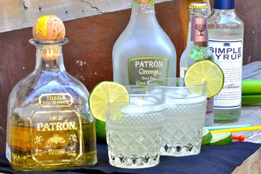 Low Carb Margarita Recipe Two Margaritas with Bottles of Patron on a Table