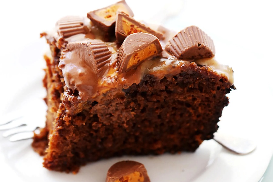 Crockpot Halloween Recipes a Slice of Chocolate Cake Topped with Peanut Butter Cups