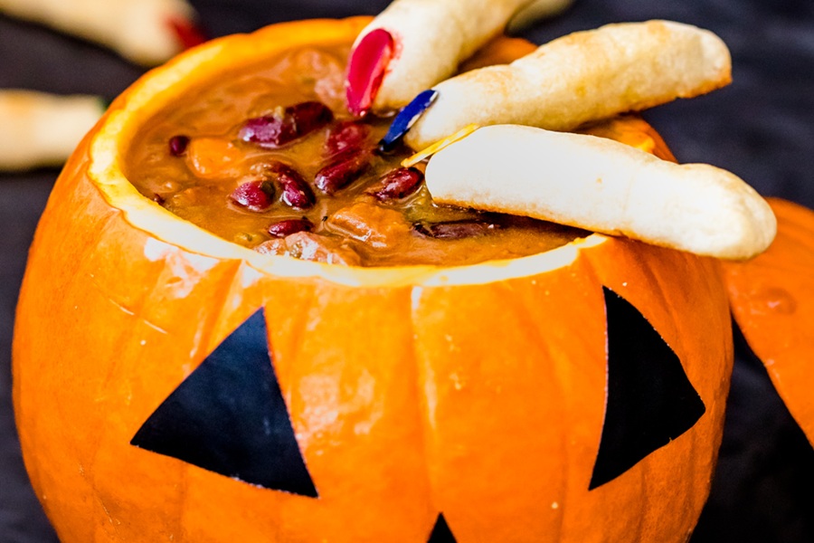 Crockpot Halloween Recipes Beef Soup in a Pumpkin with Bread Sticks On Top Made to Look like Fingers in How They Are Cut