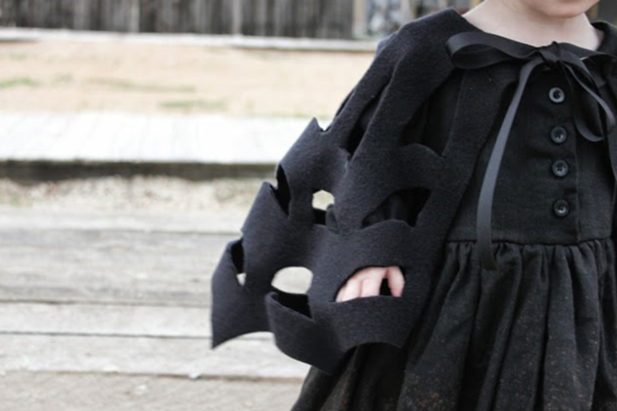 DIY Halloween Costumes For Kids a Young Child Wearing a Spider Web Cape