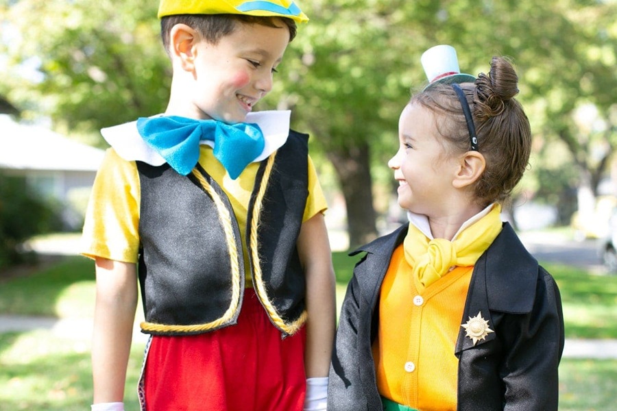 DIY Halloween Costumes For Kids a Little Boy Dressed as Pinocchio and a Little Girl Dressed as Jiminy Cricket