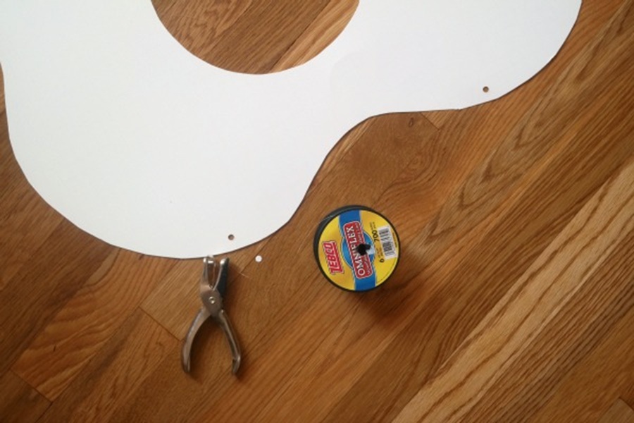 DIY Halloween Costumes For Kids Close Up of an Egg White Costume Sitting on a Wooden Surface