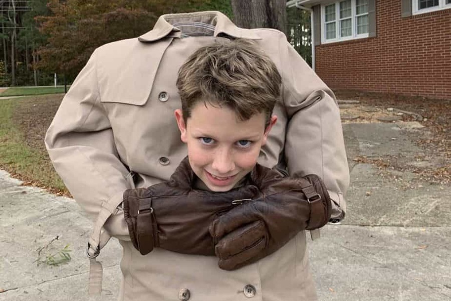 DIY Halloween Costumes For Kids a Young Boy Wearing a Headless Costume Making it Look Like His Head is in His Hands