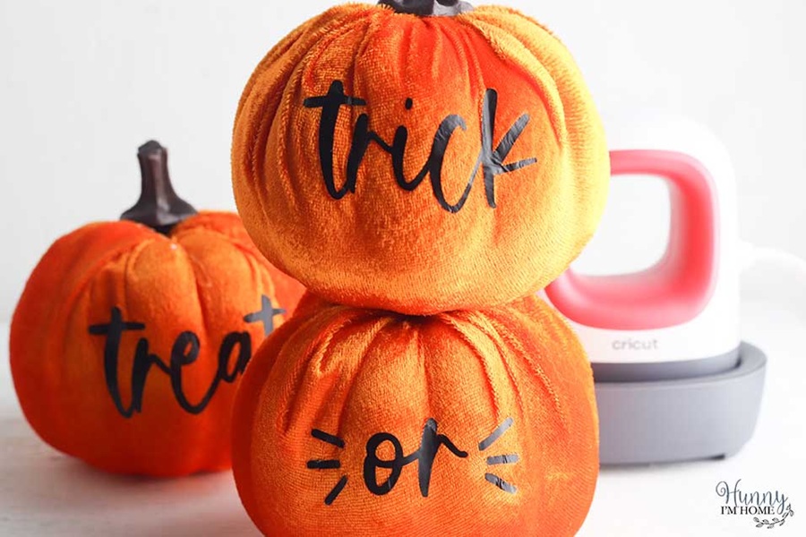 DIY Halloween Decorations Pumpkin Buckets Covered in Orange Vibrant Cloth with Trick Or Treat Written on Them
