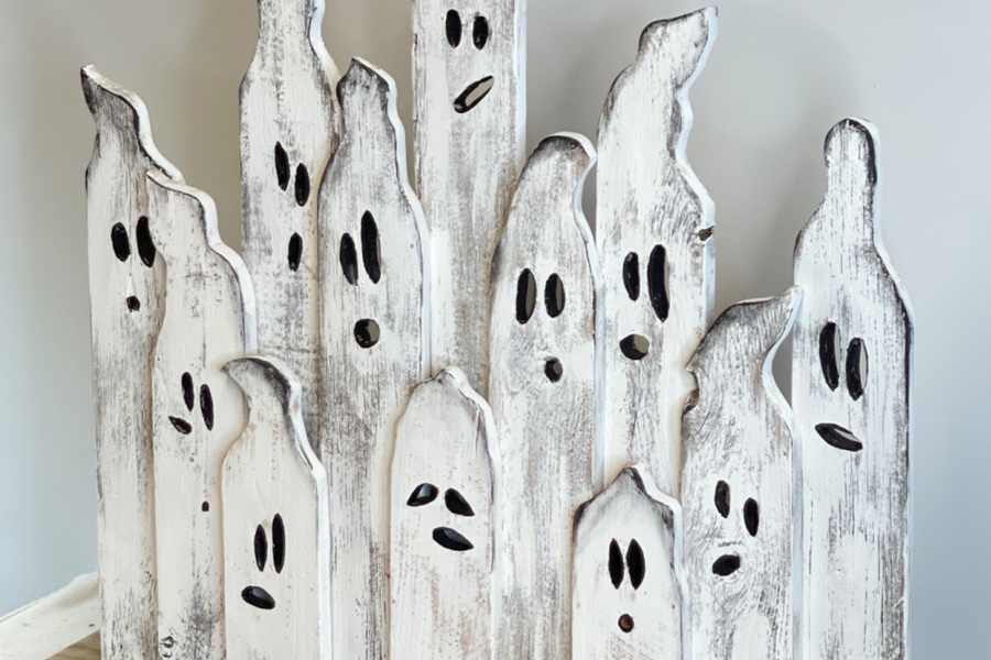 DIY Halloween Decorations Scrap Wood Painted White with Faces to Look Like Ghosts