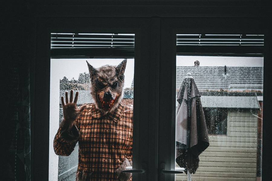 Downloads for your Halloween Playlist a Man Wearing a Werewolf Mask Standing on the Other Side of a Window