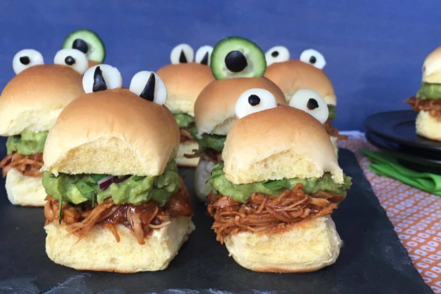 Spooky Halloween Crockpot Recipes Shredded Meat Sliders with Olives Stuck to the Top Buns to Look Like Eyes