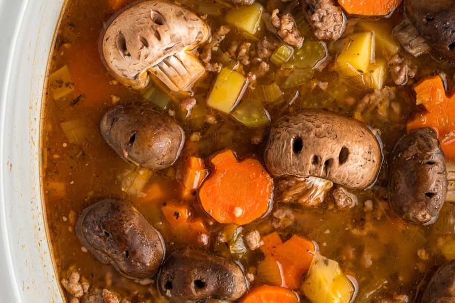 Spooky Halloween Crockpot Recipes Beef Stew with Mushroom Cap "Skulls" With Holes Poked in them to Look Like Skulls 