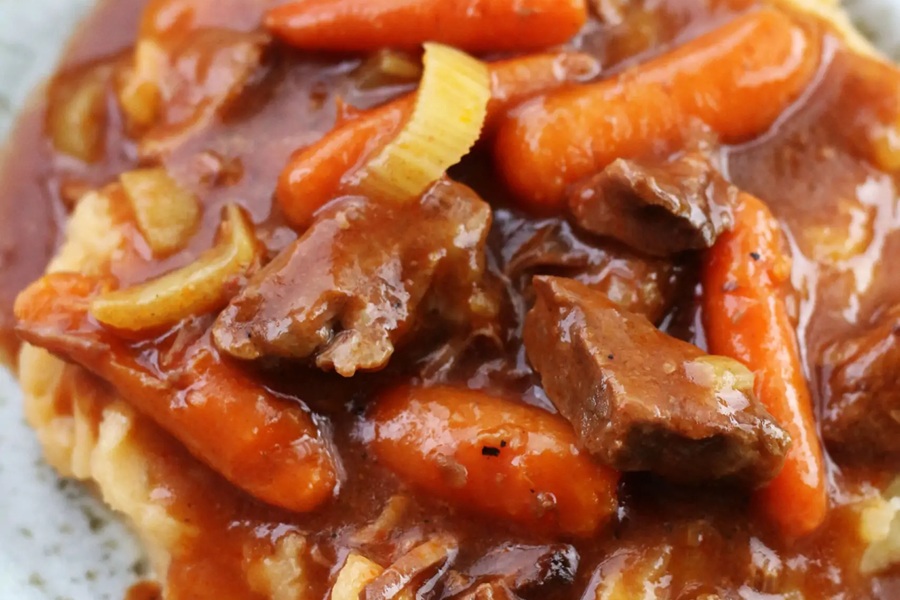 Spooky Halloween Crockpot Recipes Close Up of a Stew with Beef Carrots and Onions