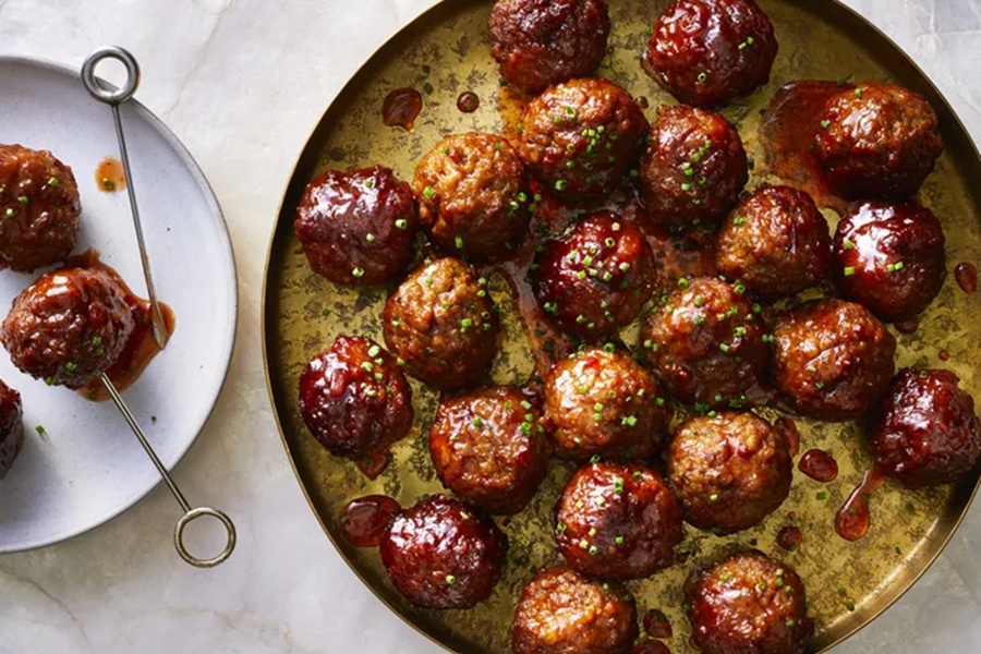 Spooky Halloween Crockpot Recipes a Serving Tray of Grape Jelly BBQ Meatballs