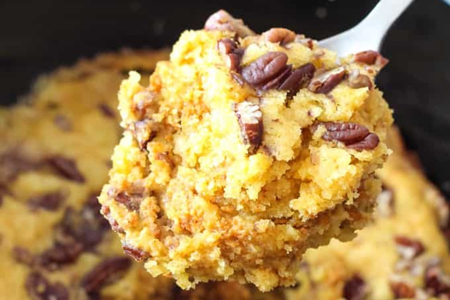 Spooky Halloween Crockpot Recipes Close Up of a Scoop of Dump Cake with Almonds